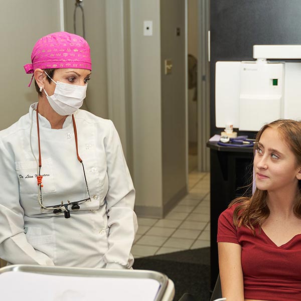 Dentist talking to patient